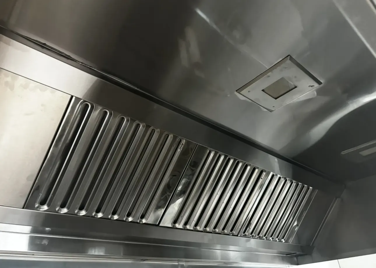 The same kitchen hood canopy and baffle filters clean and shining after cleaning